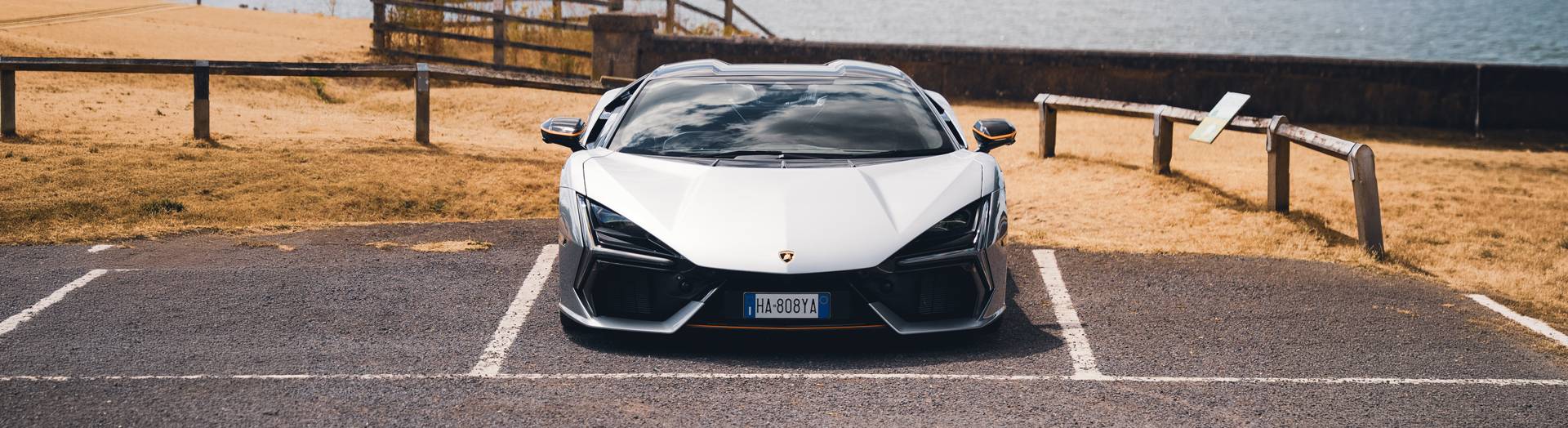 Front of a Lamborghini Revuelto in sliver with orange trims