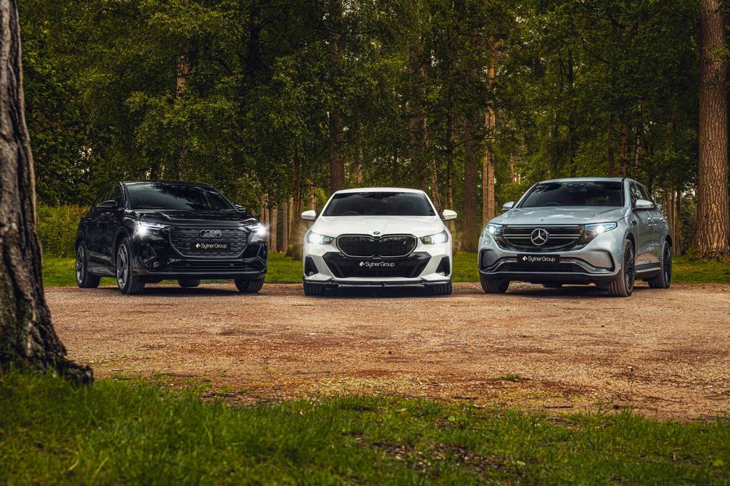 Audi SUV, BMW Saloon and Mercedes-Benz SUV parked in a woodland area