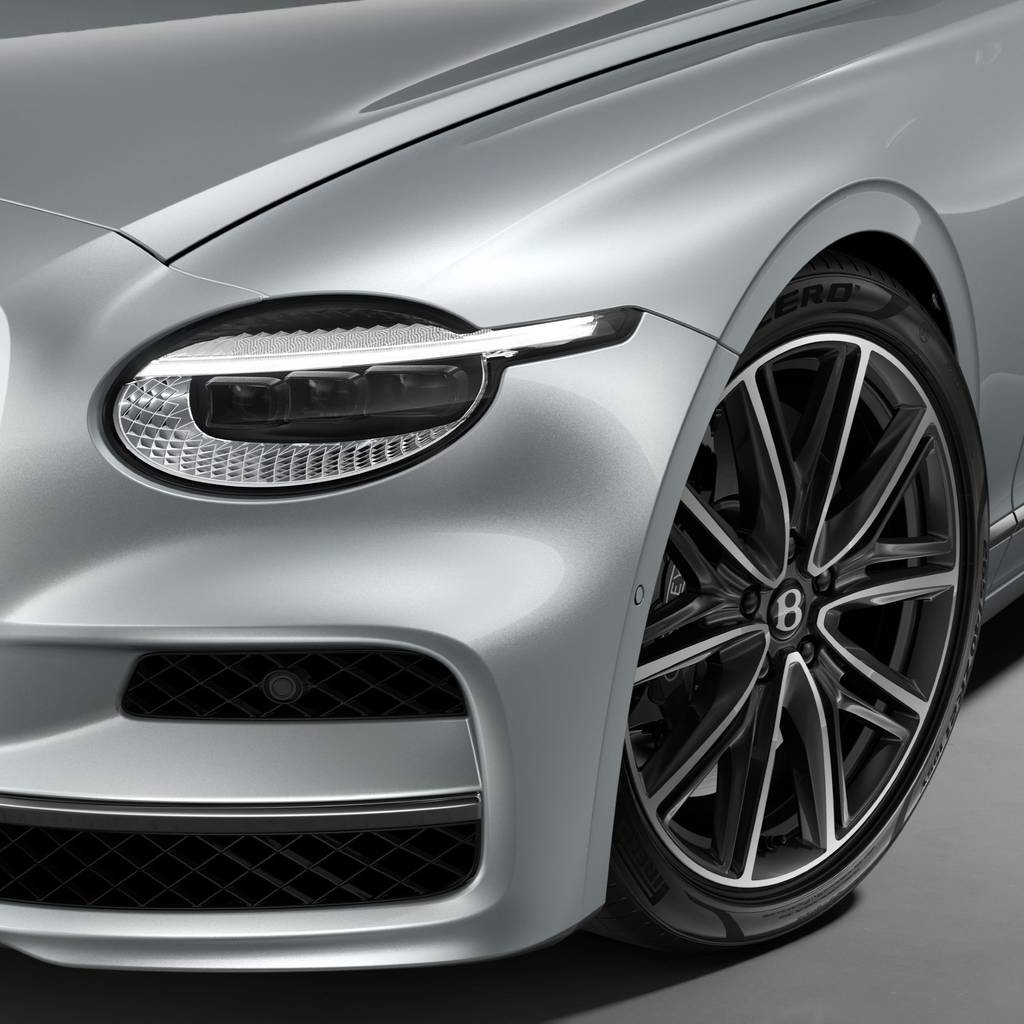 Head lamp and front wheel of Bentley Flying Spur finished in Moonbeam silver head lamp and wheel