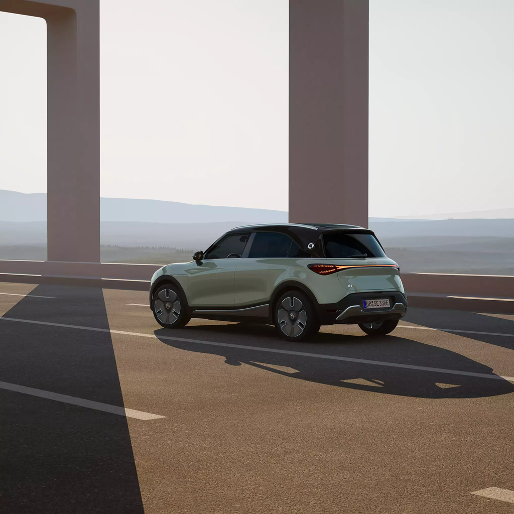 A new smart #3 driving across an empty bridge