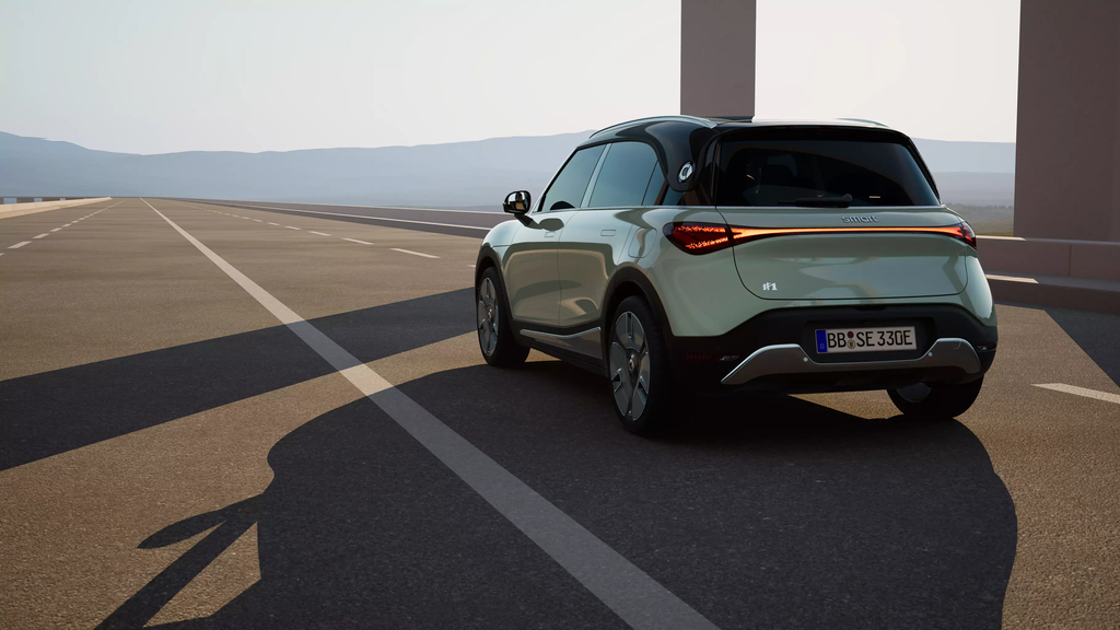 The rear of a new smart #3, looking forward to an empty motorway in front