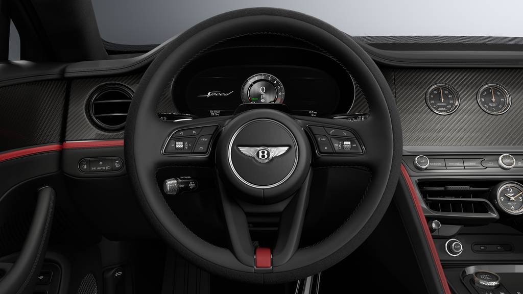 Bentley Flying Spur Speed 27MY interior in Black and red showing the steering wheel and instrument cluster