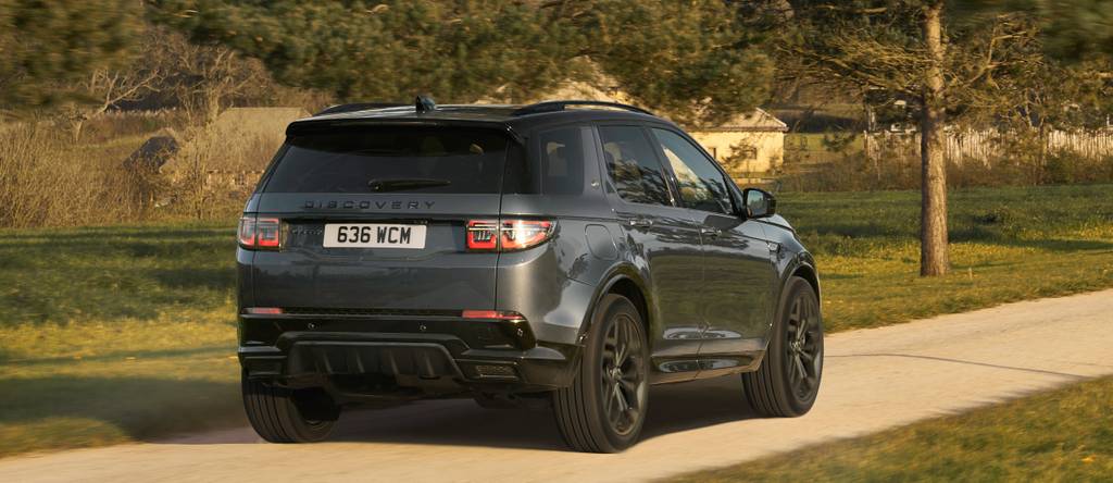 DIscovery facing away from the camera driving away on an Autumnal Day