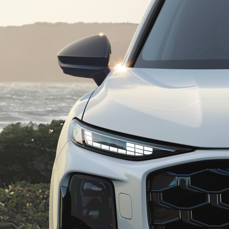 A close up of a Q3 e-hybrid headlight, showcasing the different light signatures