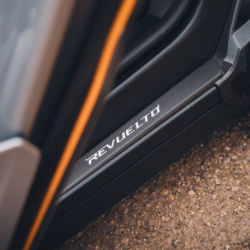 Lamborghini Revuelto in sliver with orange trims, door sill details