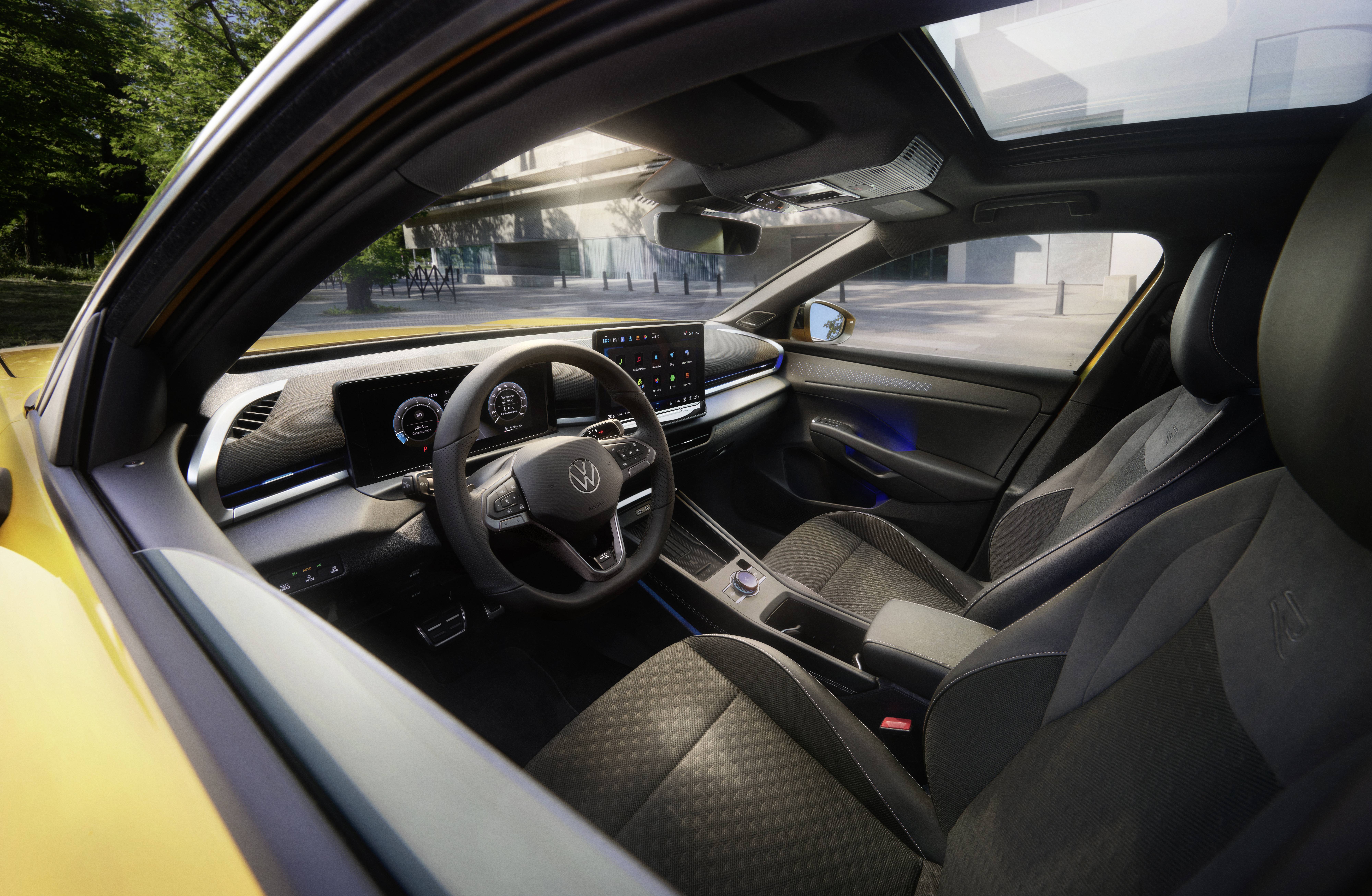 T-Roc yellow interior through window showing steering wheel, seats. central screen and pedals