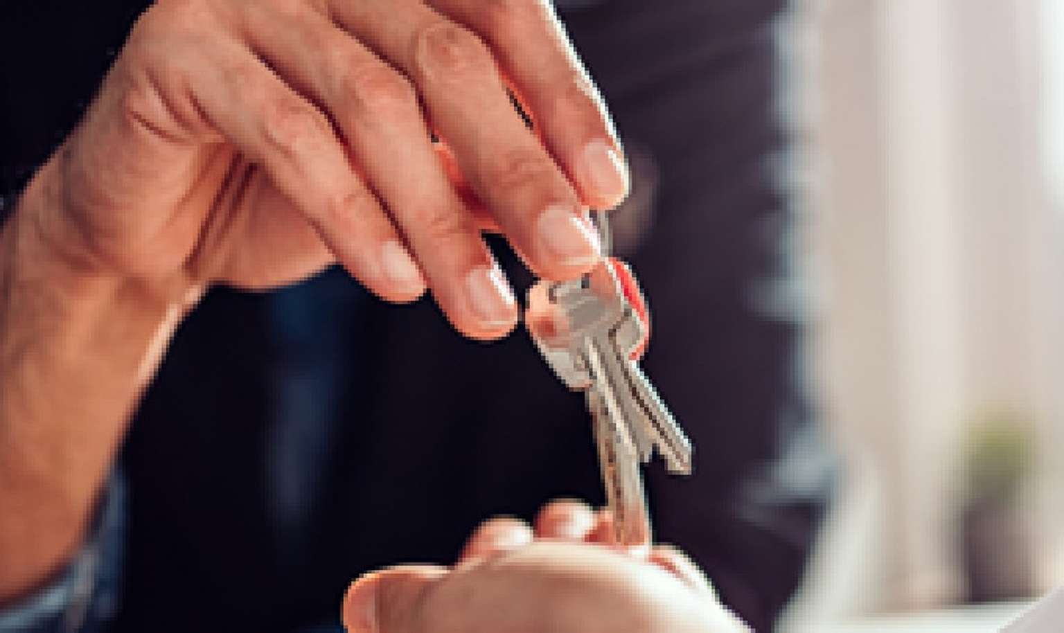 keys to a new home handed to a buyer