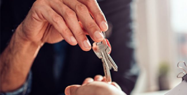 keys to a new home handed to a buyer