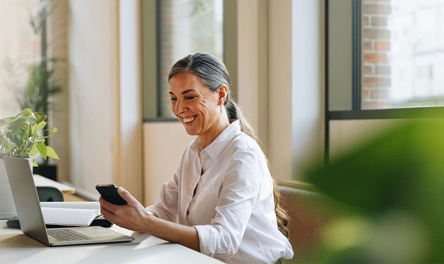 Woman working on a laptop in office