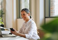 Woman working on a laptop in office