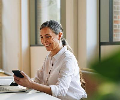 Woman working on a laptop in office