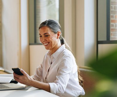 Woman working on a laptop in office
