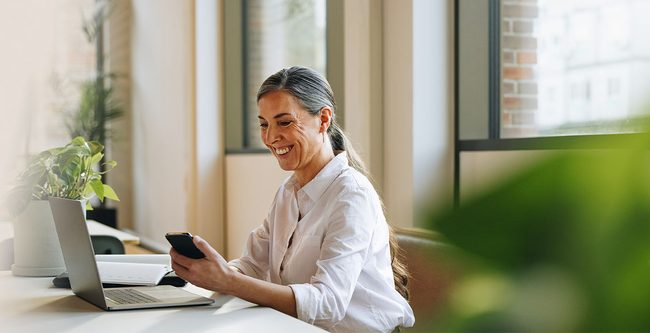 Woman working on a laptop in office