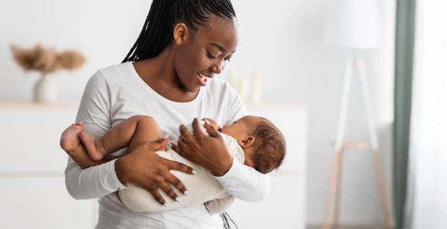 young mother holding her baby in her arms