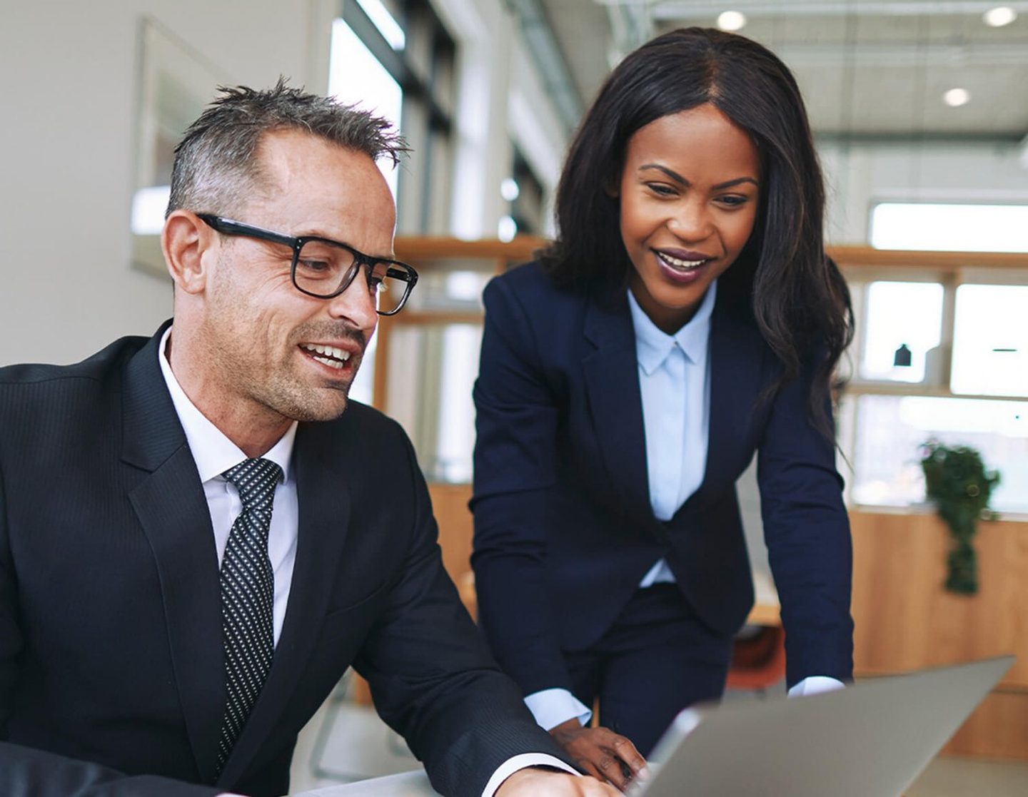 Lawyers working together on a laptop