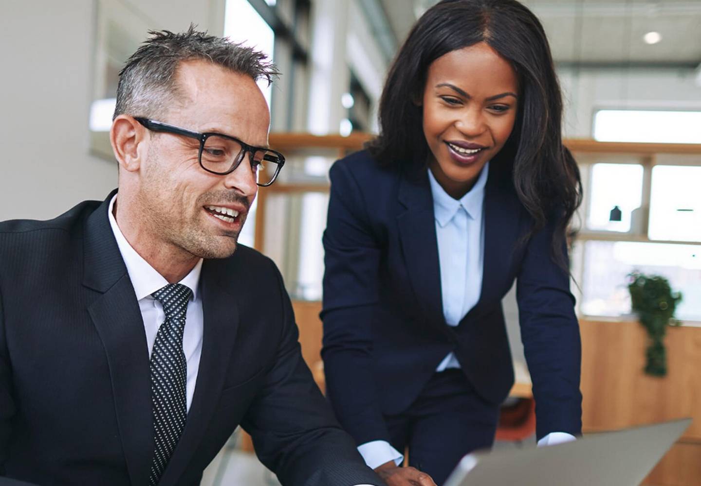 Lawyers working together on a laptop