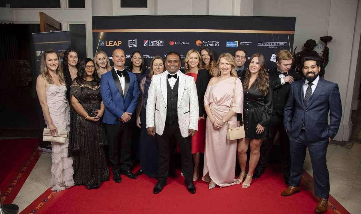 a group of people on red carpet