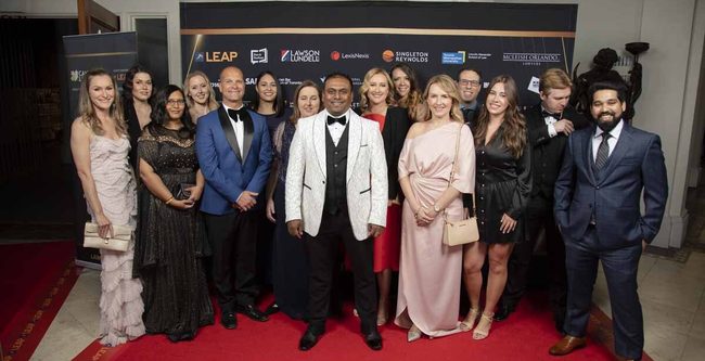 a group of people on red carpet