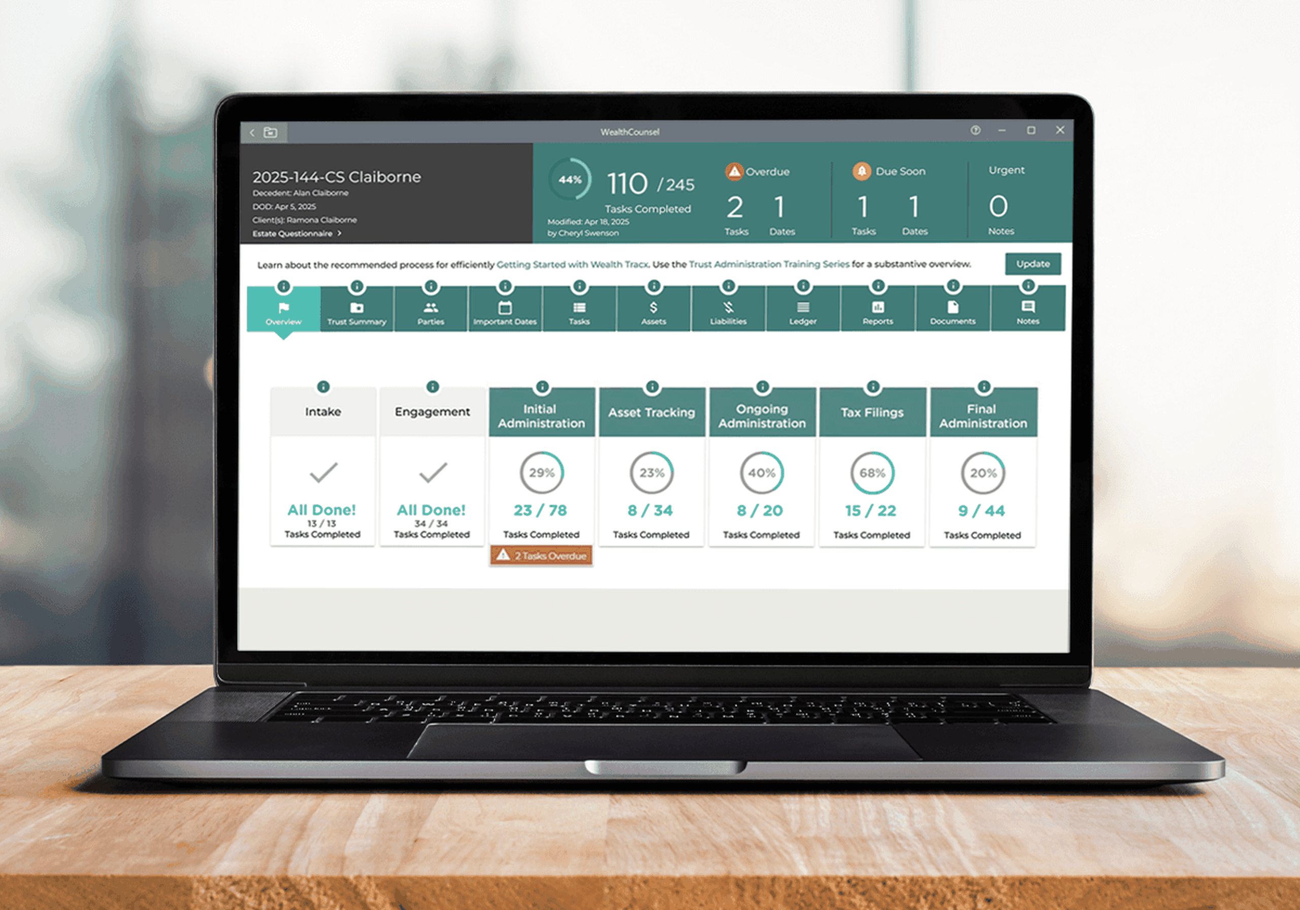 Laptop displaying a trust administration screen of Wealth Tracx.