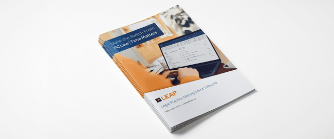 Stack of brochures titled "Make the Switch From PCLaw | Time Matters" featuring LEAP Legal Practice Management Software with an office image.