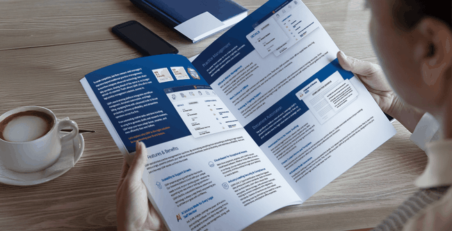 Person reading LEAP's mid to large firm brochure.