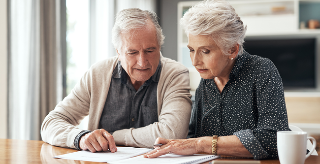 older couple looking at documents
