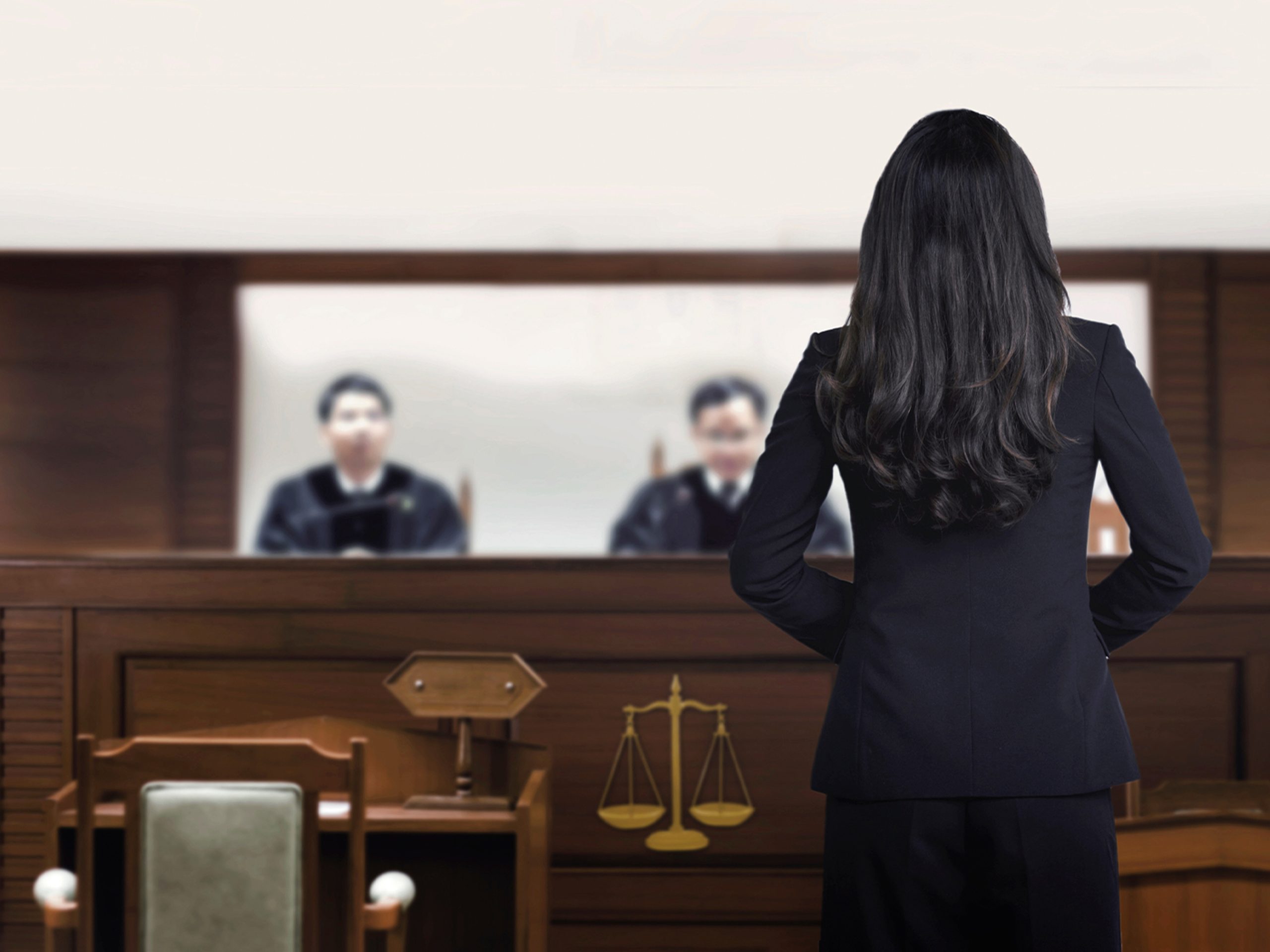 Man in hand cuffs with head hanging low