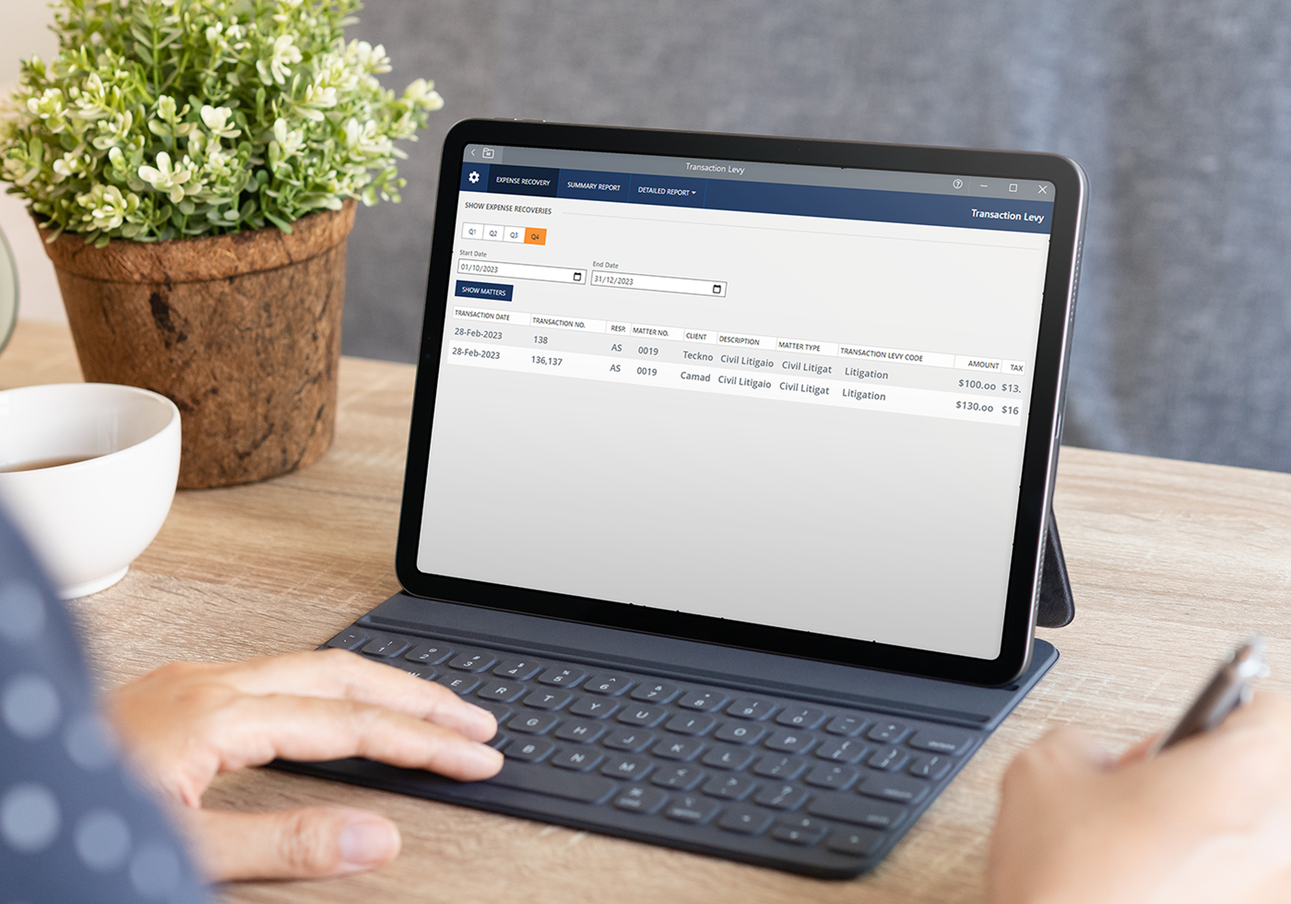a person typing on a tablet
