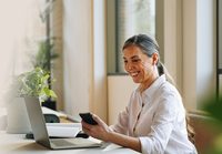 Woman working on a laptop in office