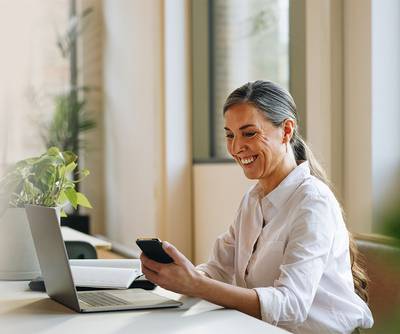 Woman working on a laptop in office