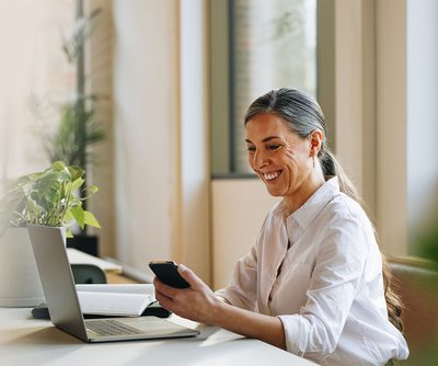 Woman working on a laptop in office