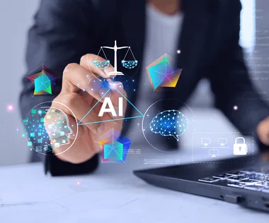 Businessperson's hand pointing at floating AI icons—brain, network, digital head, scales and security symbols above a laptop.