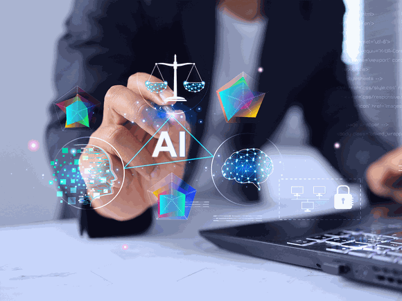 Businessperson's hand pointing at floating AI icons—brain, network, digital head, scales and security symbols above a laptop.