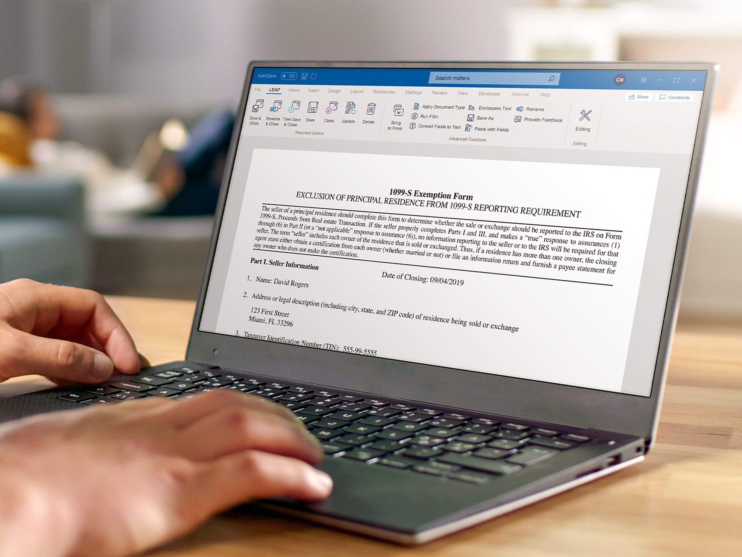 lawyer working on laptop using leap software showing a real estate form