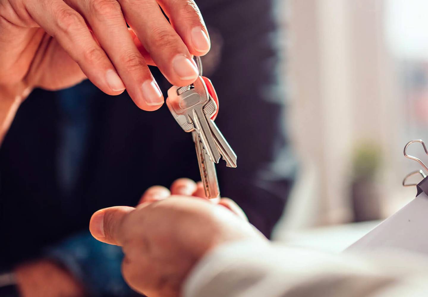 Lawyer handing over keys to client