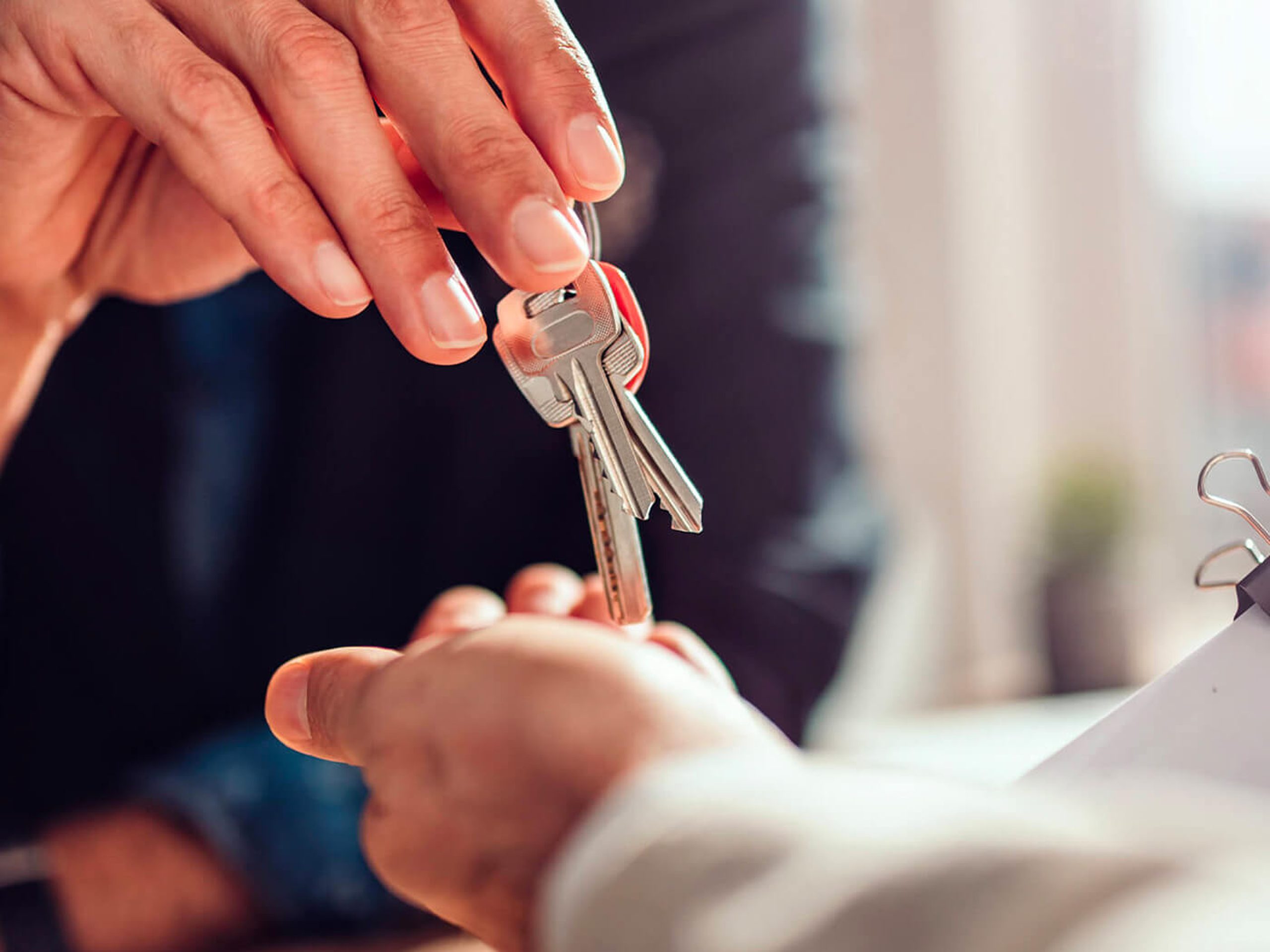 Lawyer handing over keys to client