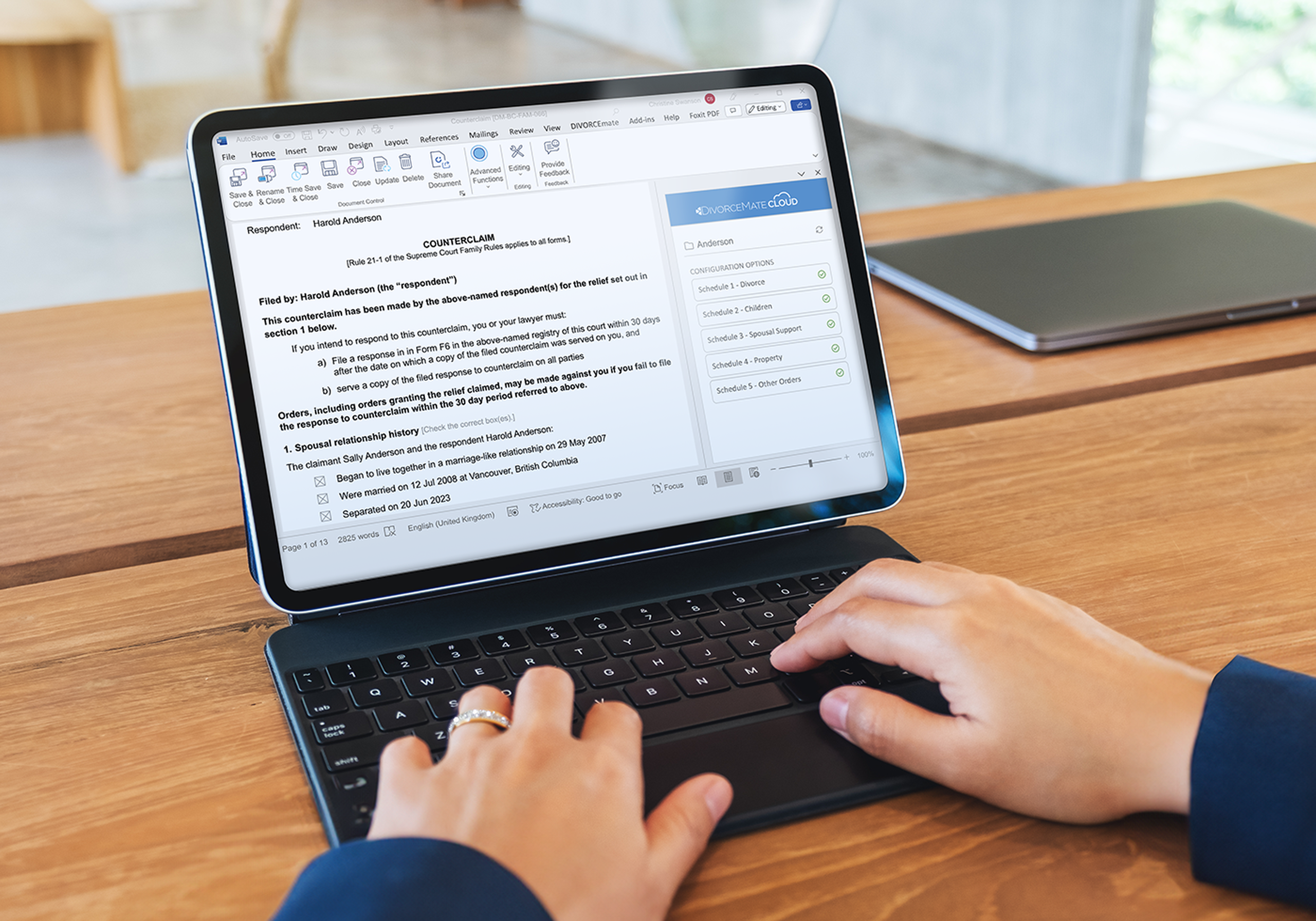 a person typing on a tablet