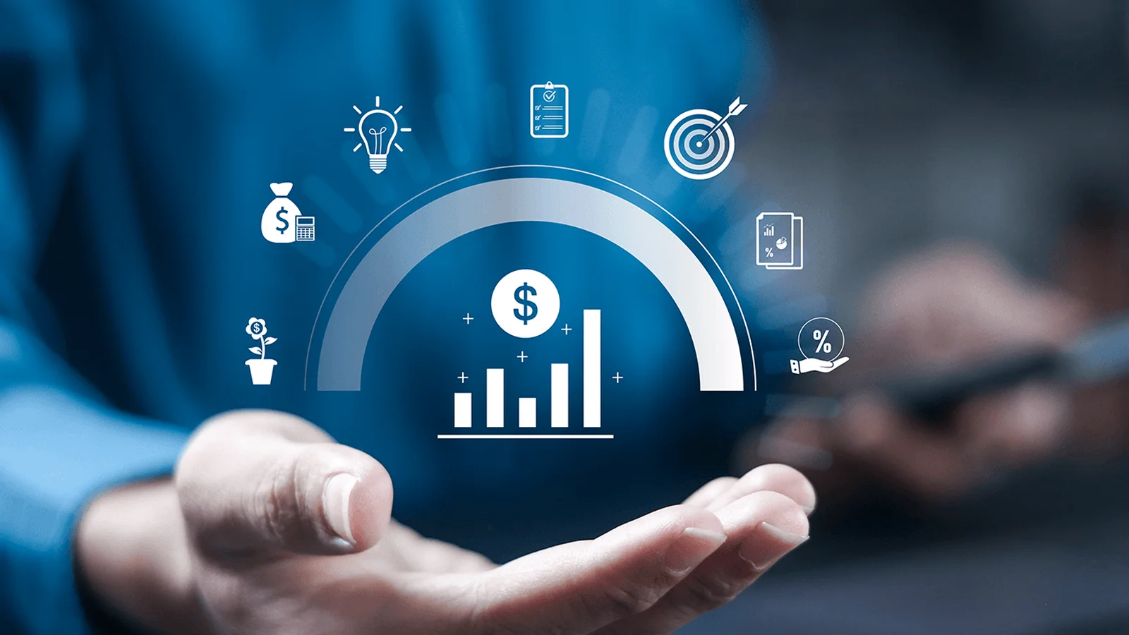 Hand holding holographic financial icons, including bar graph, dollar sign, and light bulb, symbolizing business growth and strategy.