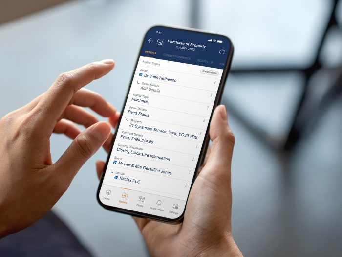 lawyer holding phone showing leap software matter details screen