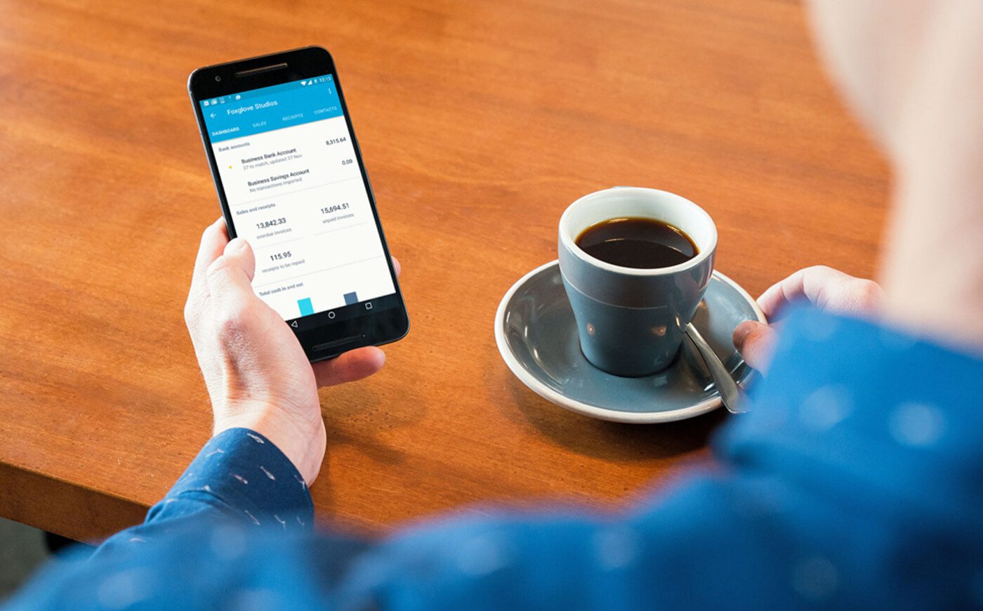 drinking coffee using xero mobile app