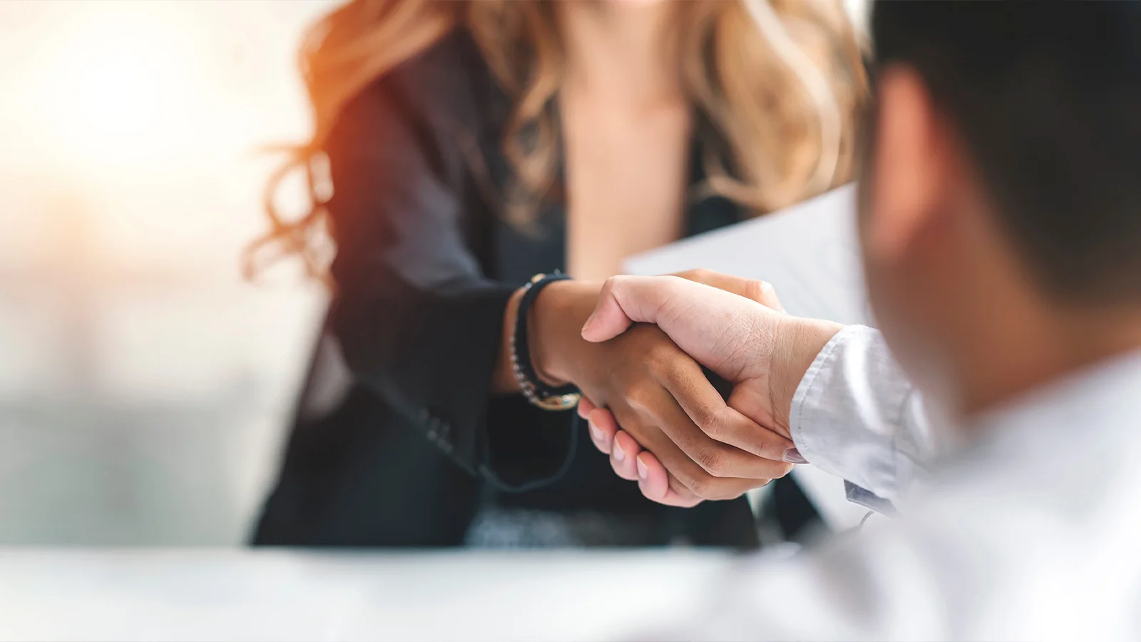 lawyer shaking hands with client