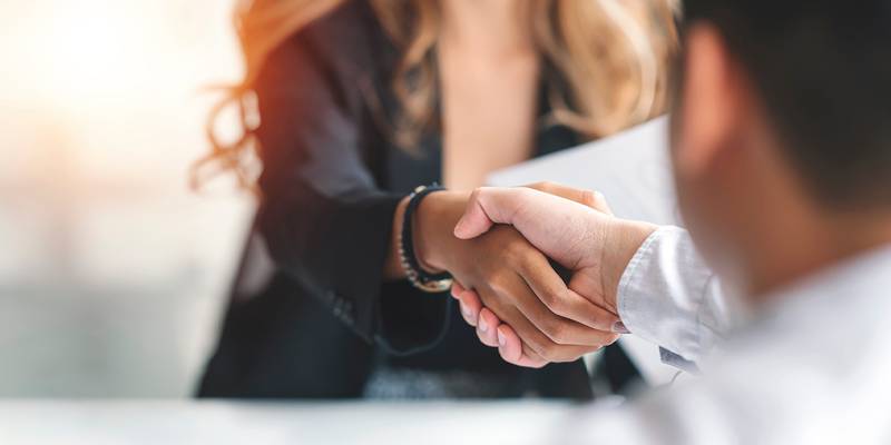 lawyer shaking hands with client