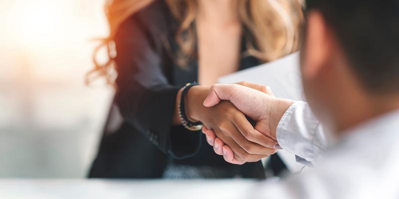 lawyer shaking hands with client
