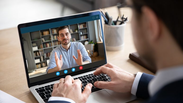 lawyer looking at laptop screen having a meeting