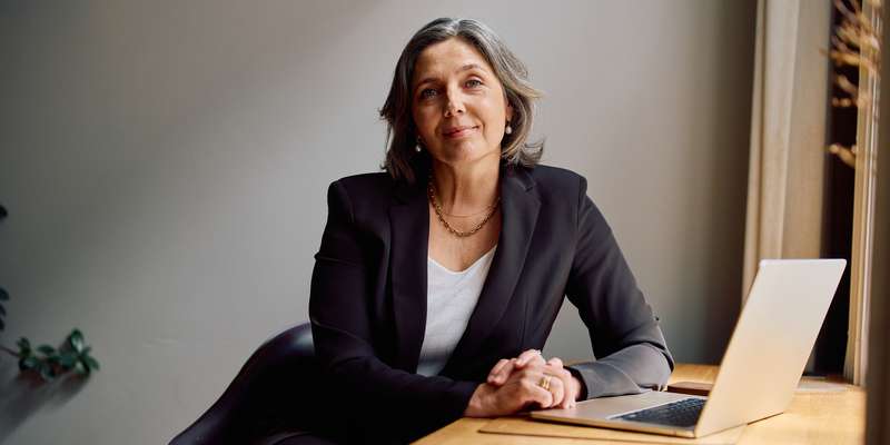 woman at desk with laptop