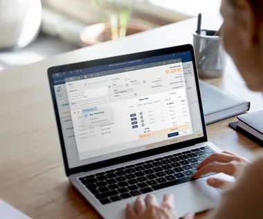 Lawyer working on laptop with new invoice leap software screen