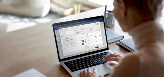 Lawyer working on laptop with new invoice leap software screen