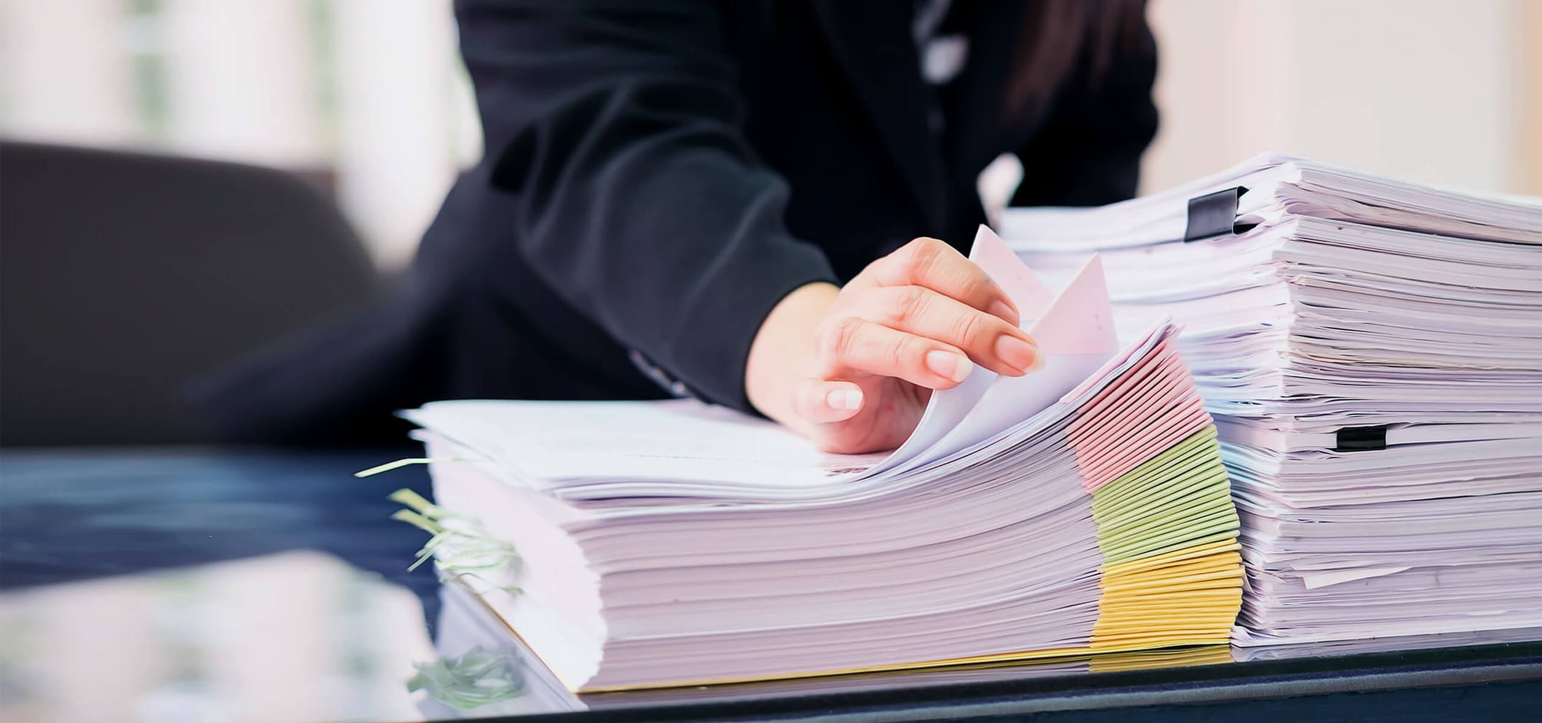 pile of papers on lawyers desk