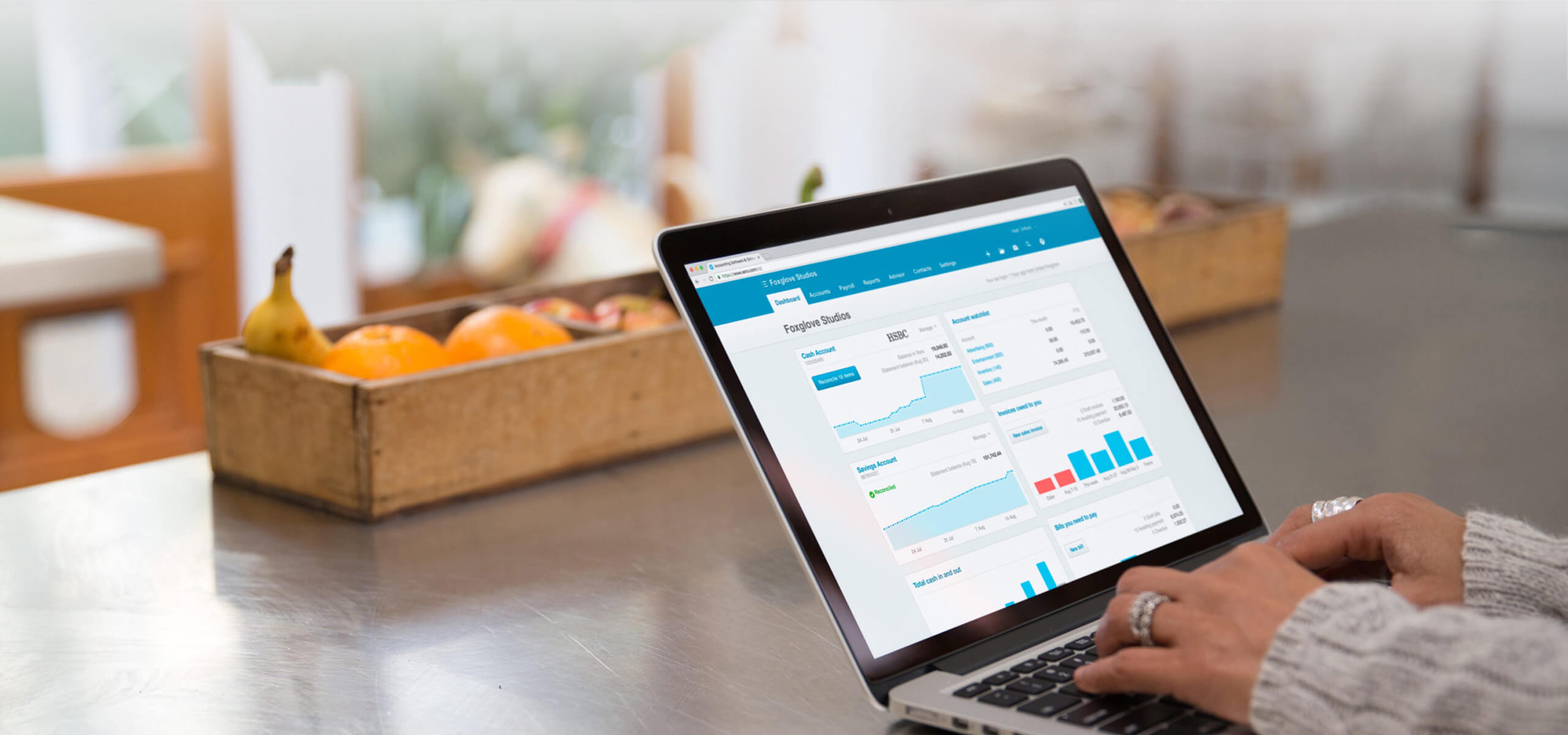 person using xero software at home on laptop