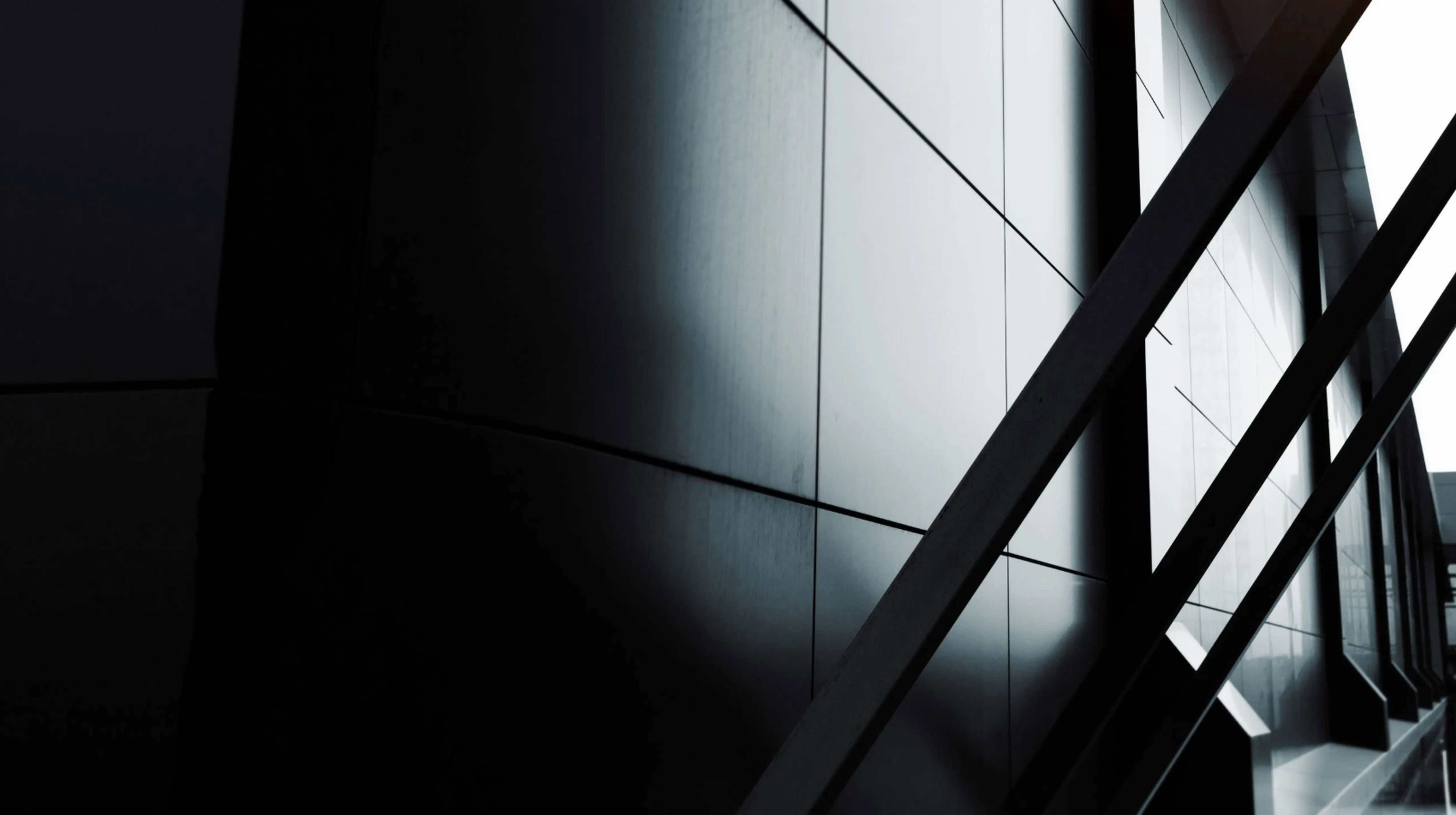 black and white abstract image of the support beams of a modern building